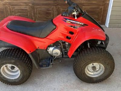 Red Honda Sportrax 90 Four Wheeler