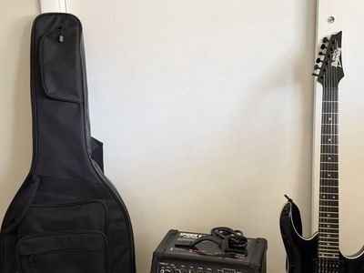 Ibanez CRGA 120BKN Gio Electric Guitar with Amplifier with cable, shoulder strap, carrying Bag, tuner, capo, and set of picks.