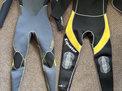 Two children wetsuits like new