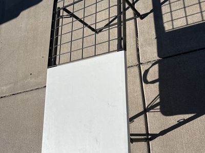 Folding table with metal grid surface