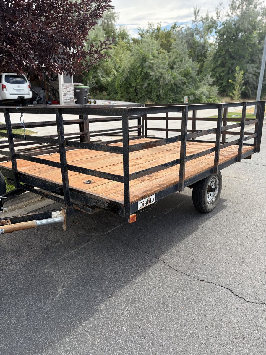 Single Axle Utility Trailer with Wooden Deck and Spare Tire