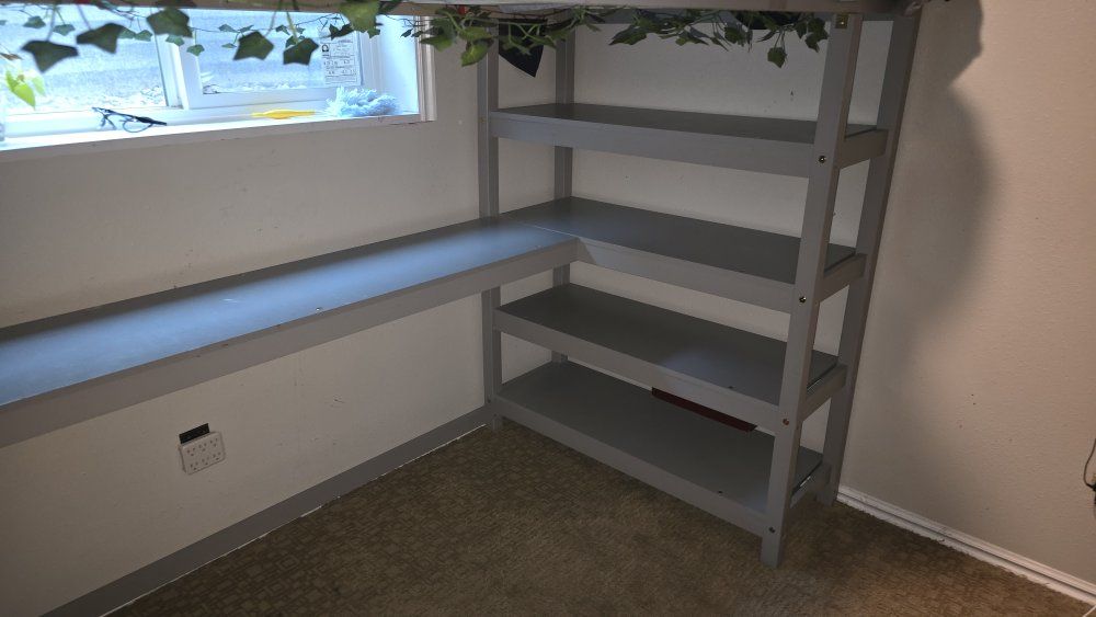 Gray Loft Bed with Integrated Desk and Shelving Unit