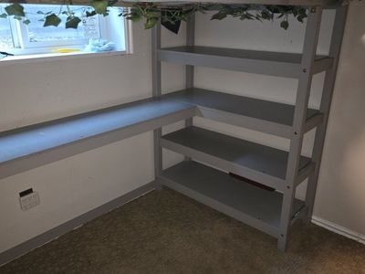 Gray Loft Bed with Integrated Desk and Shelving Unit