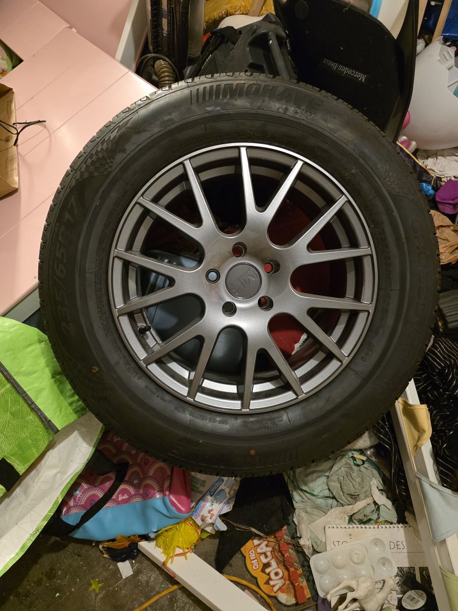 Mohave all weather 235/65 R17 tire and wheel