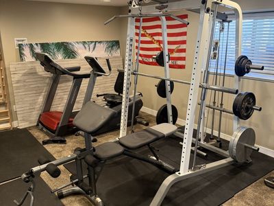 Complete home gym squat, bench, treadmill, elliptical, bike, weights cable pulls