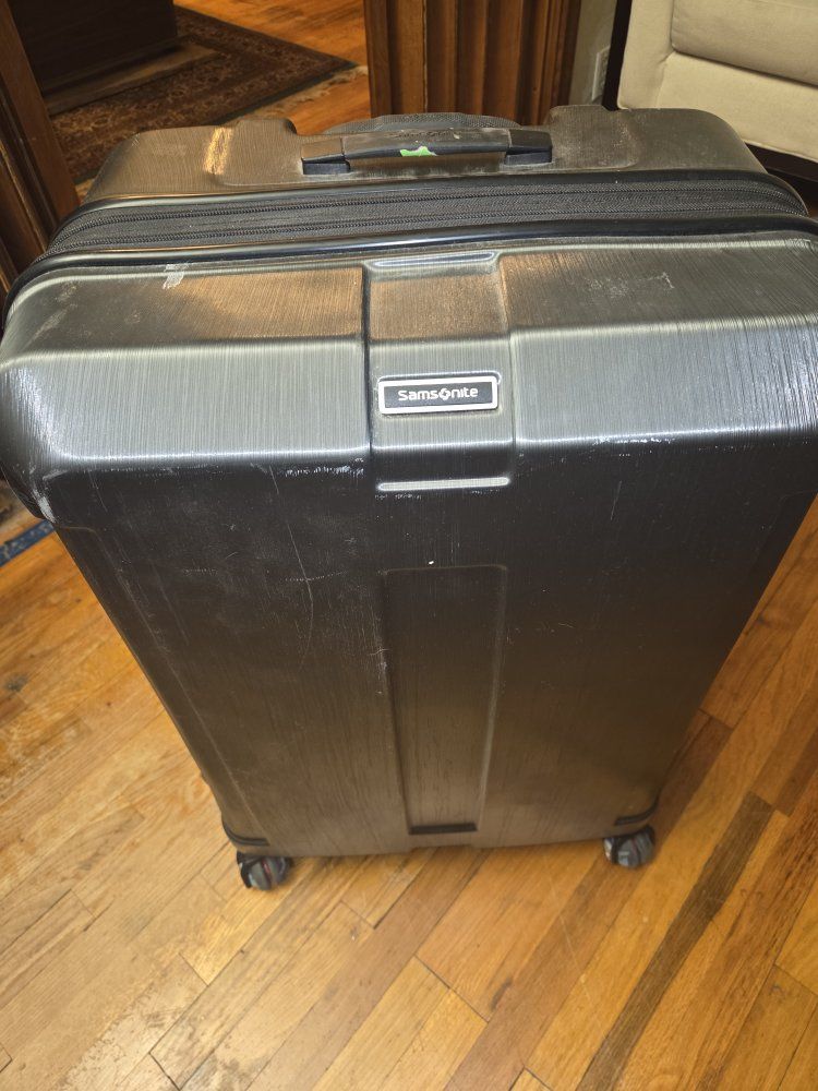 Large samsonite rolling suitcase