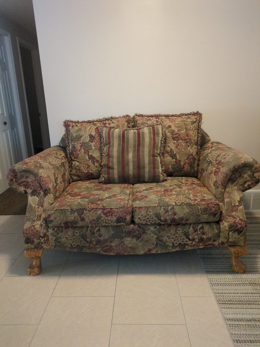 Floral Fabric Loveseat Sofa with Carved Wood Feet and Throw Pillow