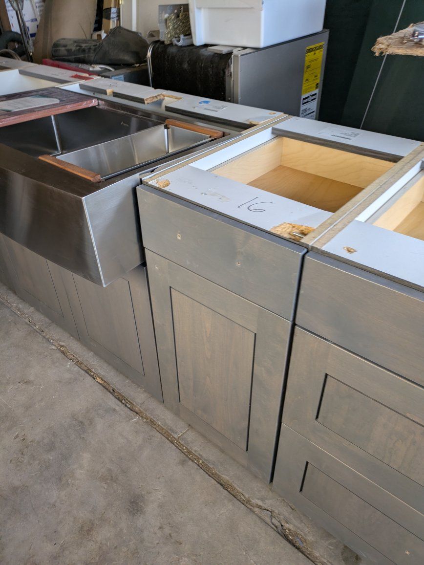 Gray Shaker Kitchen Cabinets with Stainless Steel Farmhouse Sink. we have granite and quartz countertops available