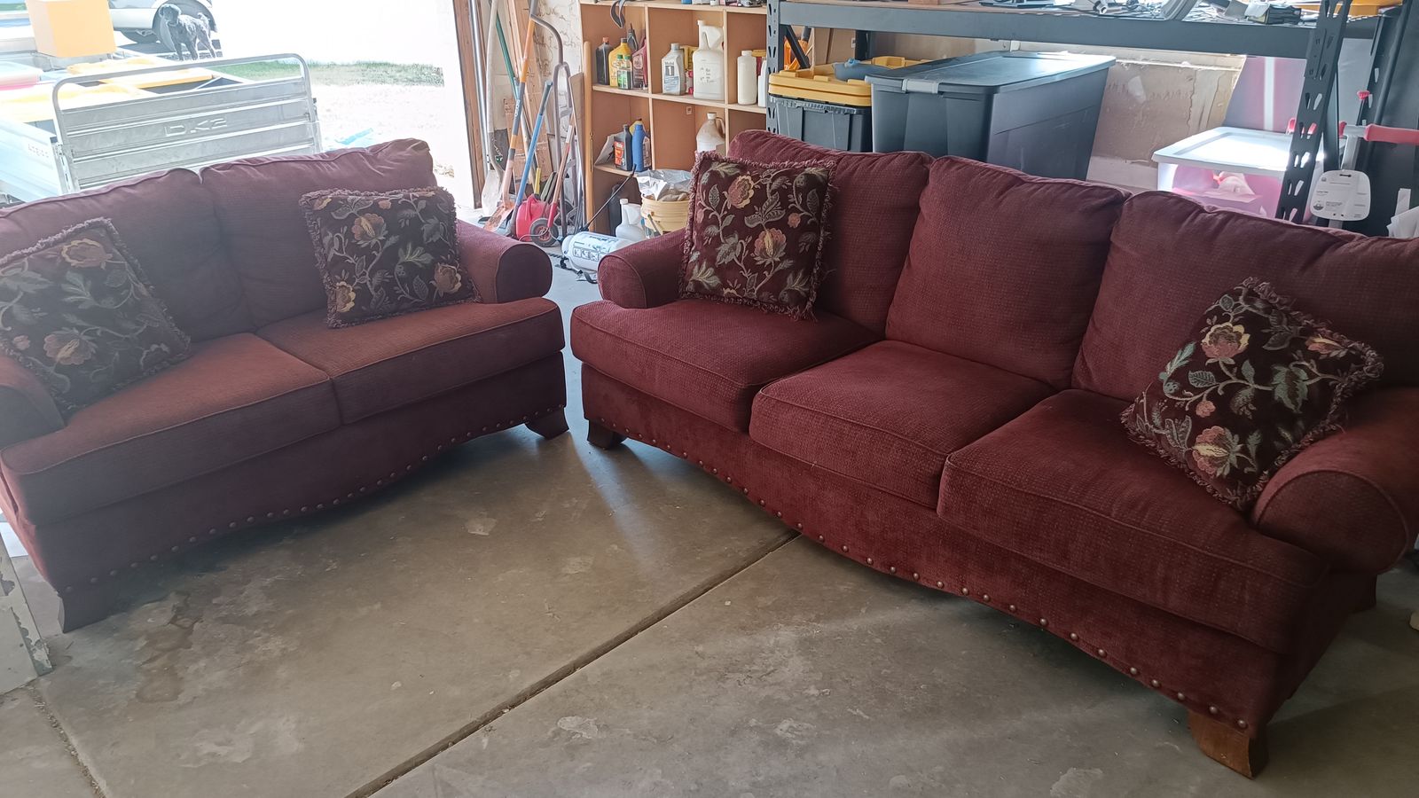 Red Sofa and Loveseat Set with Nailhead Trim and Floral Accent Pillows
