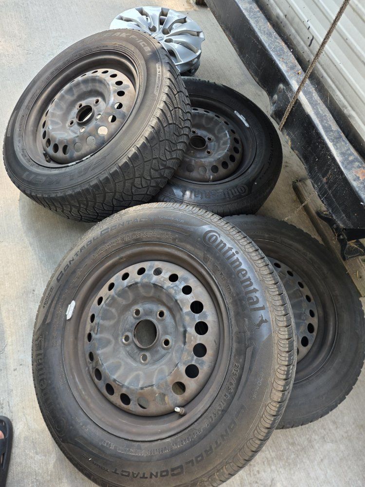 Continental ControlContact Tour A/S 205/65R16 All-Season Tires w/ Steel Rims & Hubcaps (Set of 4)