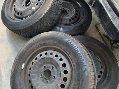 Continental ControlContact Tour A/S 205/65R16 All-Season Tires w/ Steel Rims & Hubcaps (Set of 4)