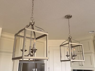 2 designer pendant lights and chandelier