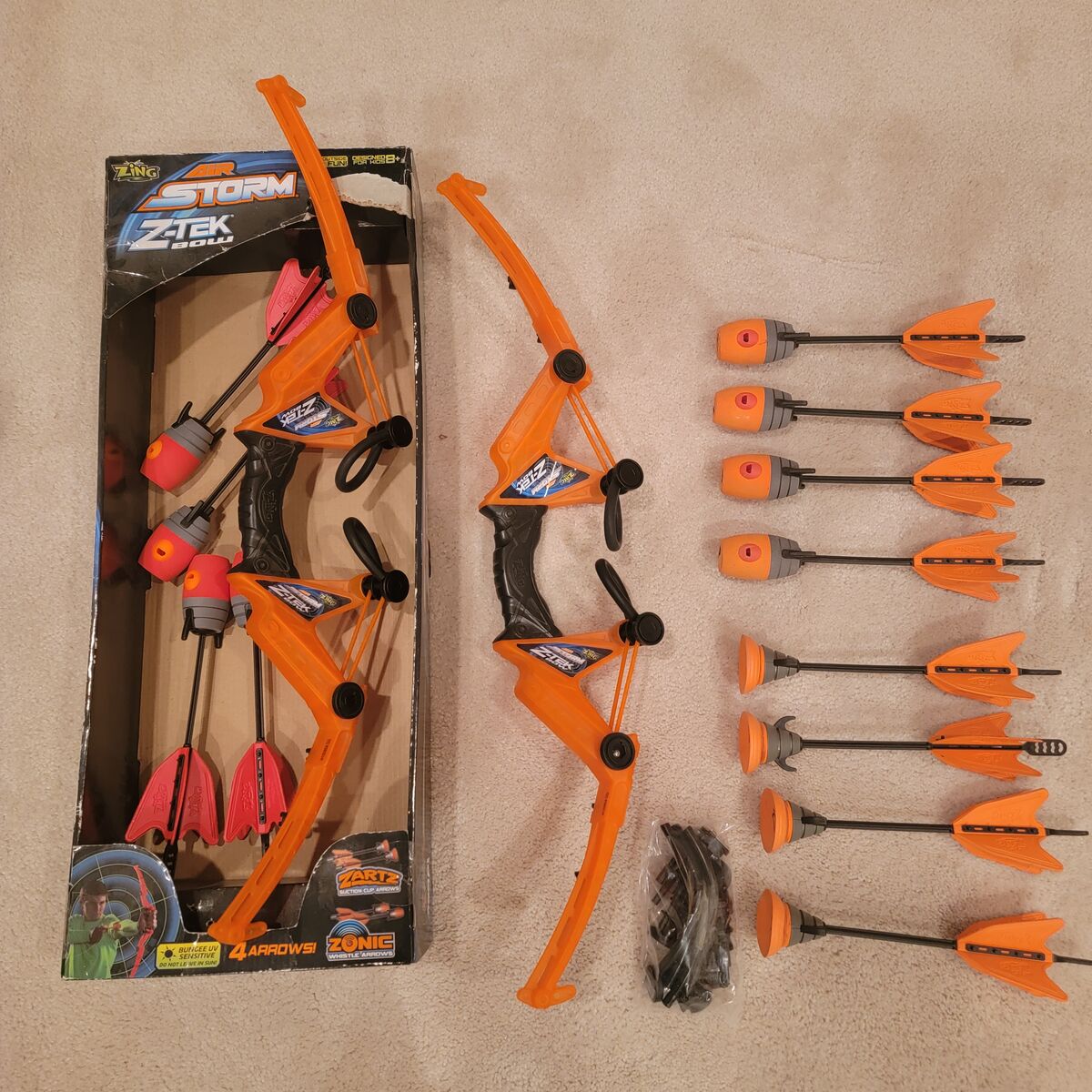 2 Zing Air-Storm Z-Tek Bows/8 Zonic Whistling Arrows/4 Suction-Cup Arrows. Shoots Up to 145 Feet!