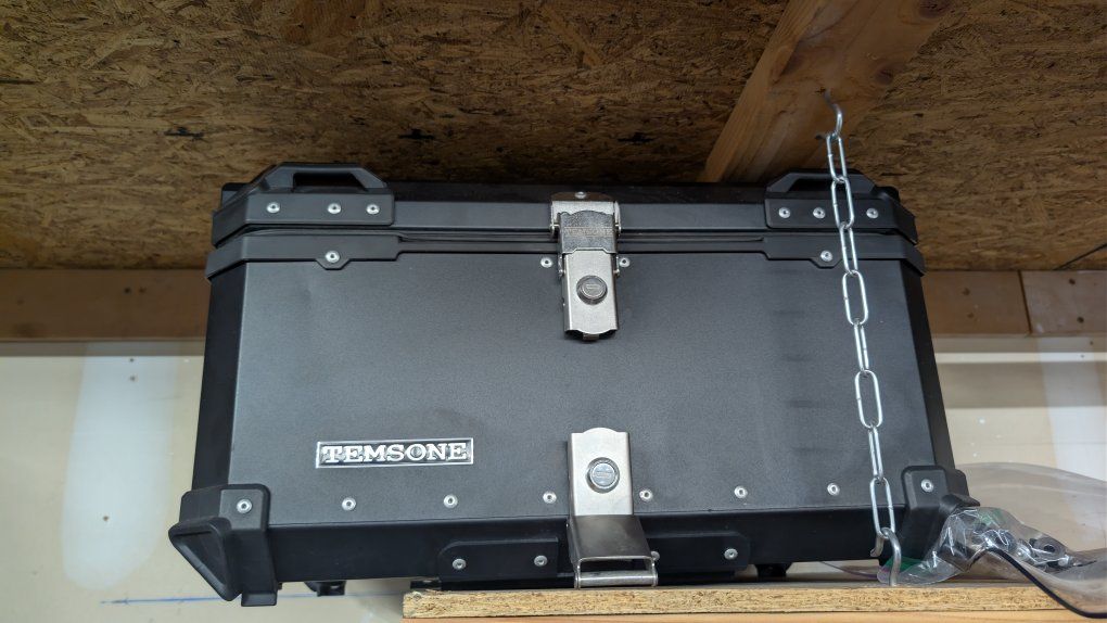 2 helmet rear motorcycle top case with universal mounting base.
