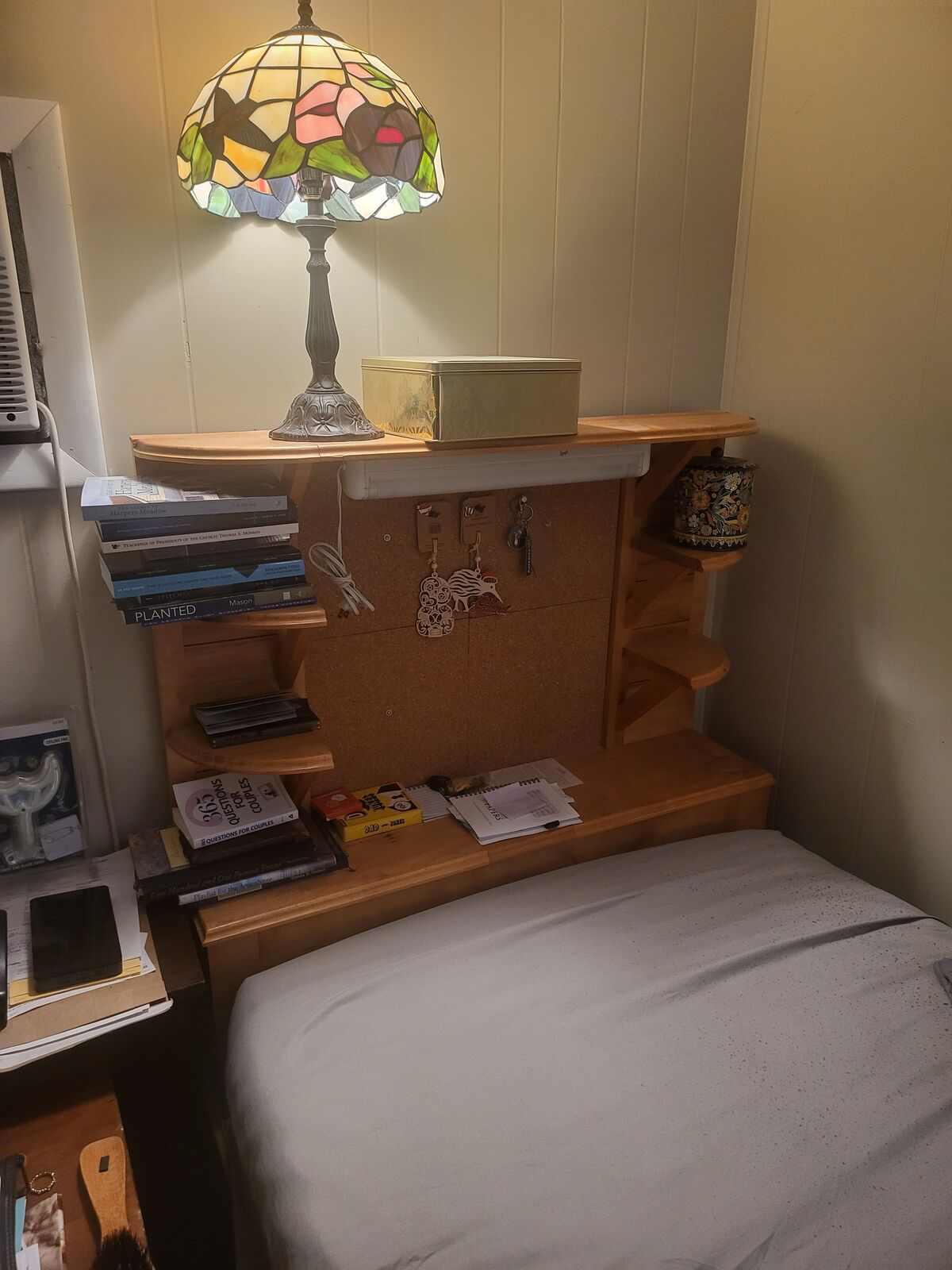 twin bed handbuilt wood headboard immense shelving underneath