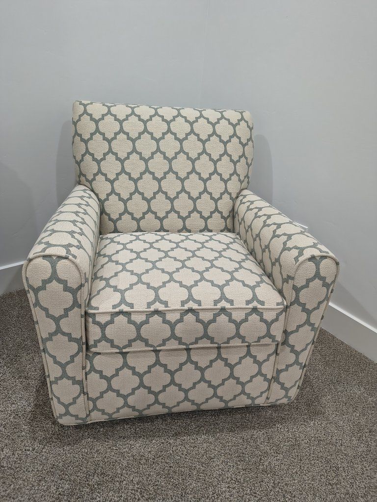 Patterned Upholstered Swivel Rocker in Beige and Muted Green 
