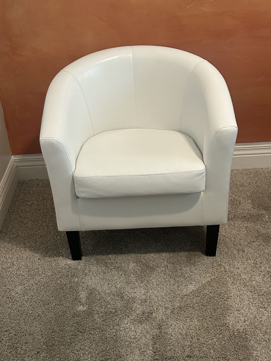 White faux leather accent barrel chair