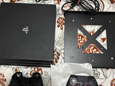 Sony PlayStation 4 (PS4) Pro 1TB Console Bundle with 1 Controller & Wall Mount