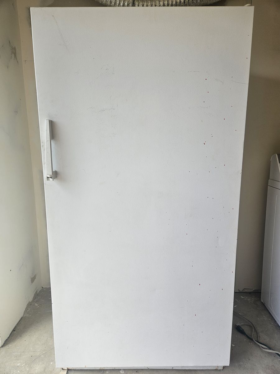 White upright freezer