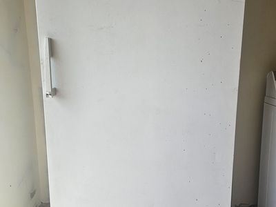 White upright freezer