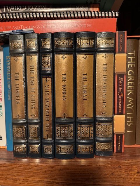 Easton Press leather-bound editions of major religious texts,