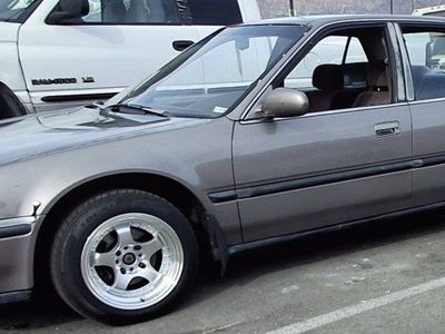 Honda Accord Sedan (1990s Model) - 4-Door, Aftermarket Wheels, Gray