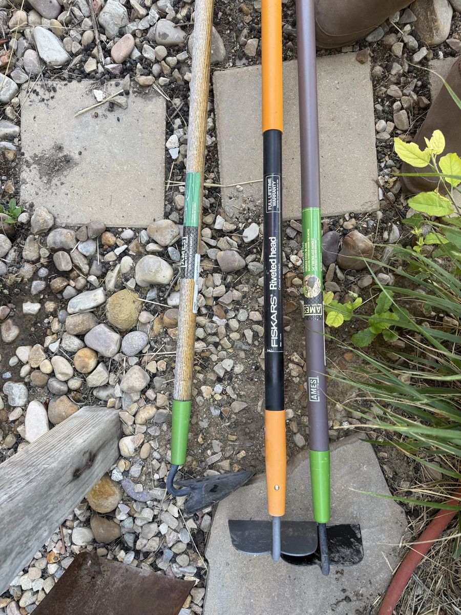 One triangle hoe and two square hoes