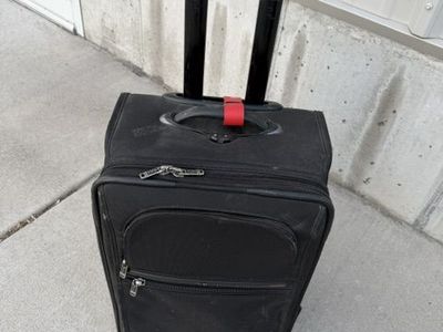 Tumi Luggage. Roll along Tumi Suitcase