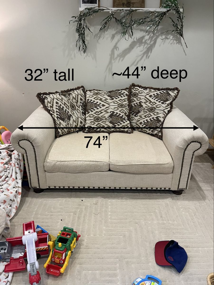 Cream Loveseat Couch 74" Wide with Nailhead Trim and Patterned Pillows
