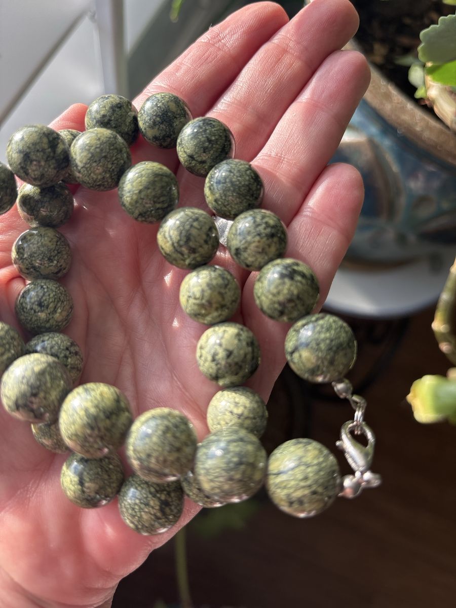 These beads are made of natural Serpentine, specifically a variety commonly marketed as Russian Serpentine.