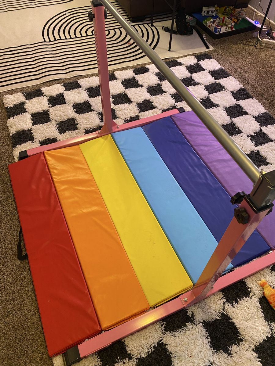 Gymnastics bar and mat