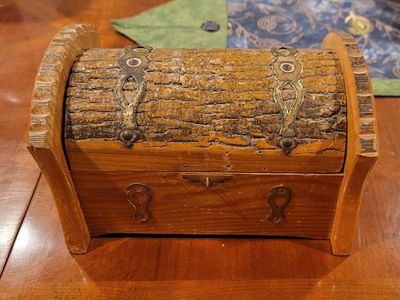 Rustic Wooden Treasure Chest with Hinged Lid and Handles