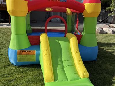 Bounceland Inflatable Bounce House with Slide - Multi-Color Castle