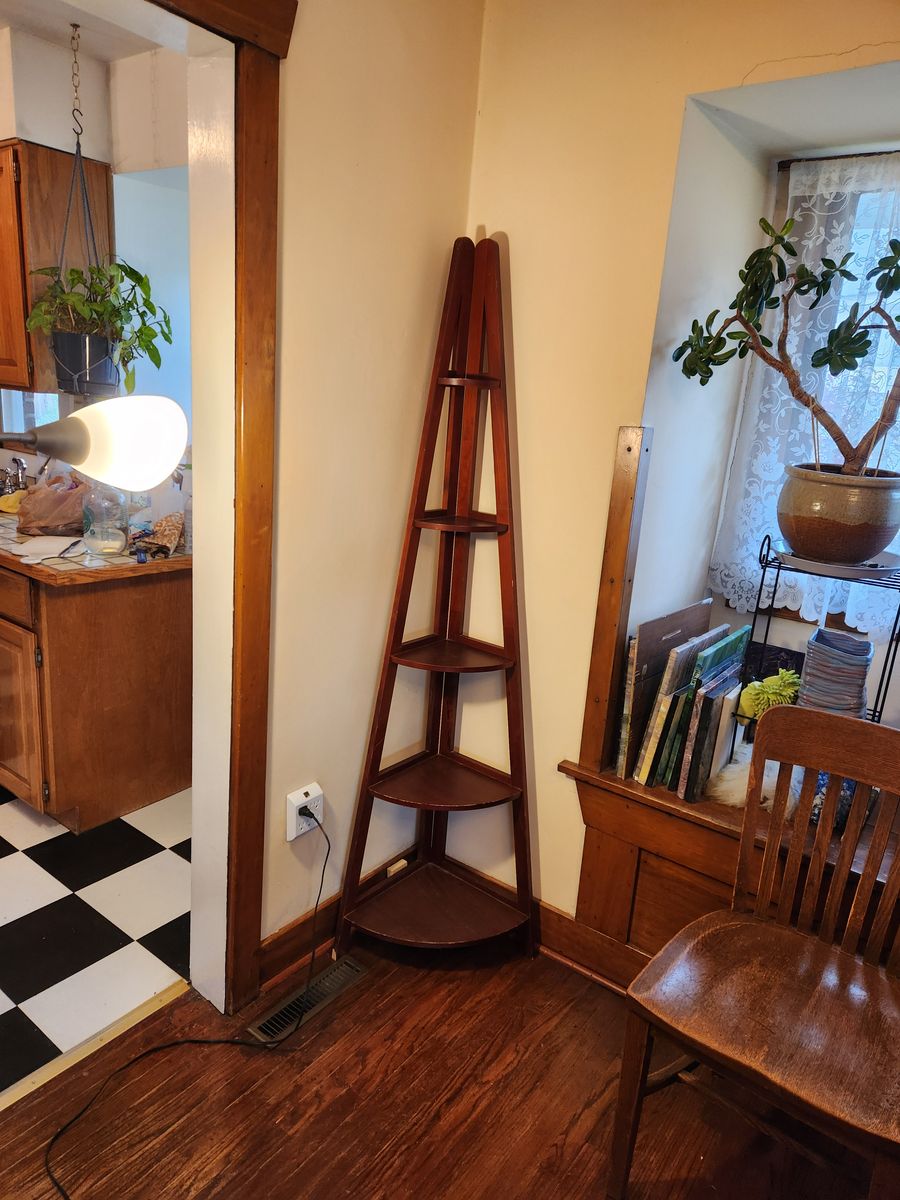Wooden corner shelving.  Four shelves. Sturdy and looks nice.