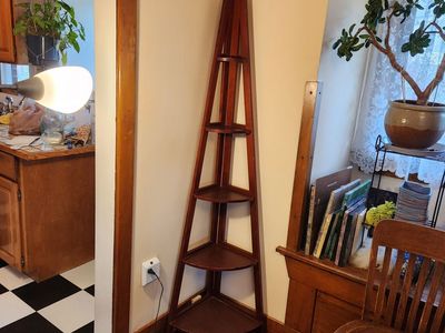 Wooden corner shelving. Four shelves. Sturdy and looks nice.