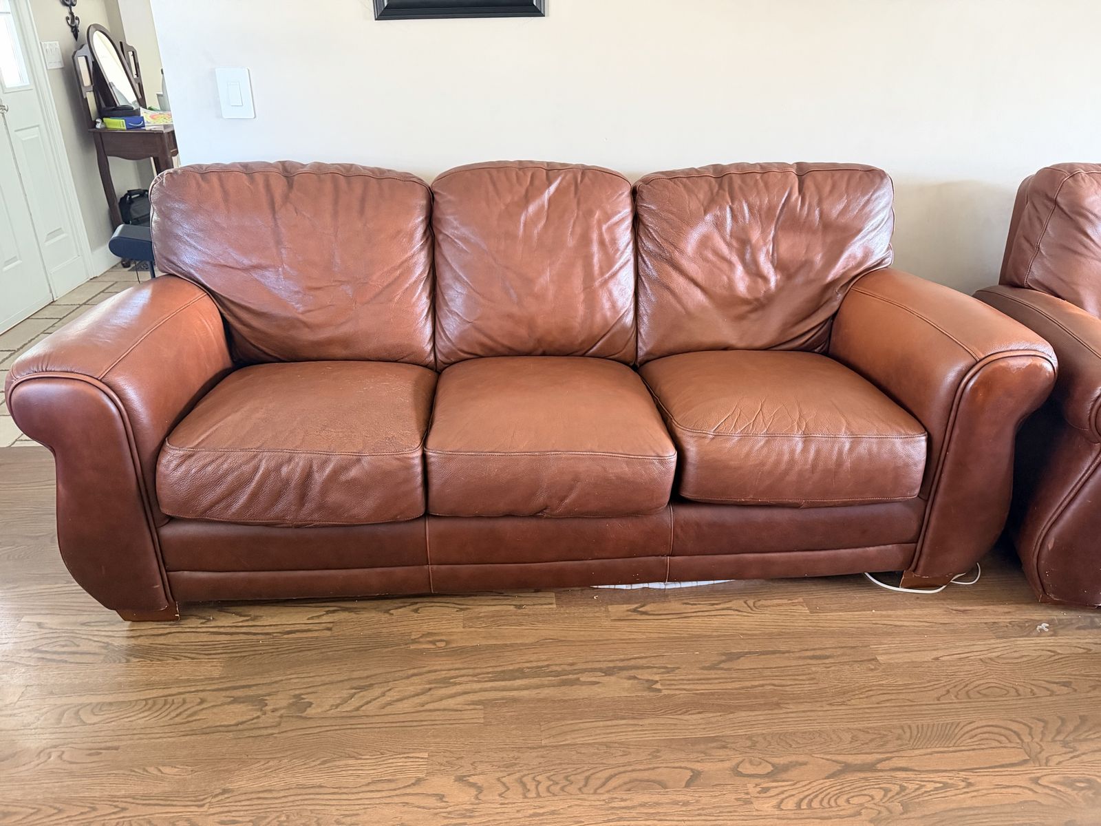 Three-Piece Brown Leather Living Room Couch, Sofa, and Reclining Chair Set