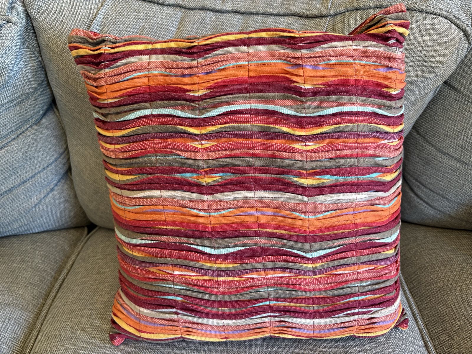 Throw Pillow w/ Different Colored Strips of Fabric