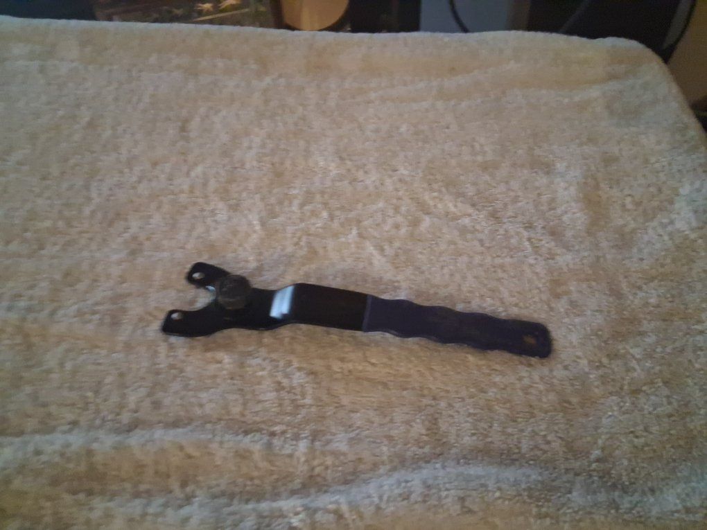 Adjustable spanner wrench.