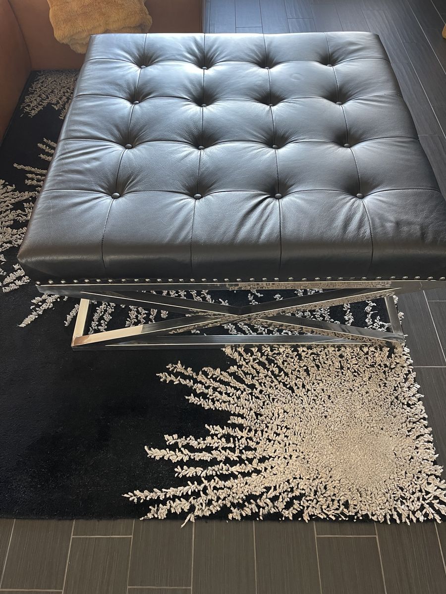 Black leather tufted ottoman/cocktail table