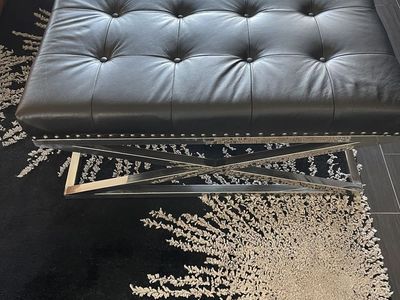 Black leather tufted ottoman/cocktail table