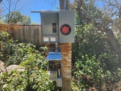 Temporary power pole and meter base.