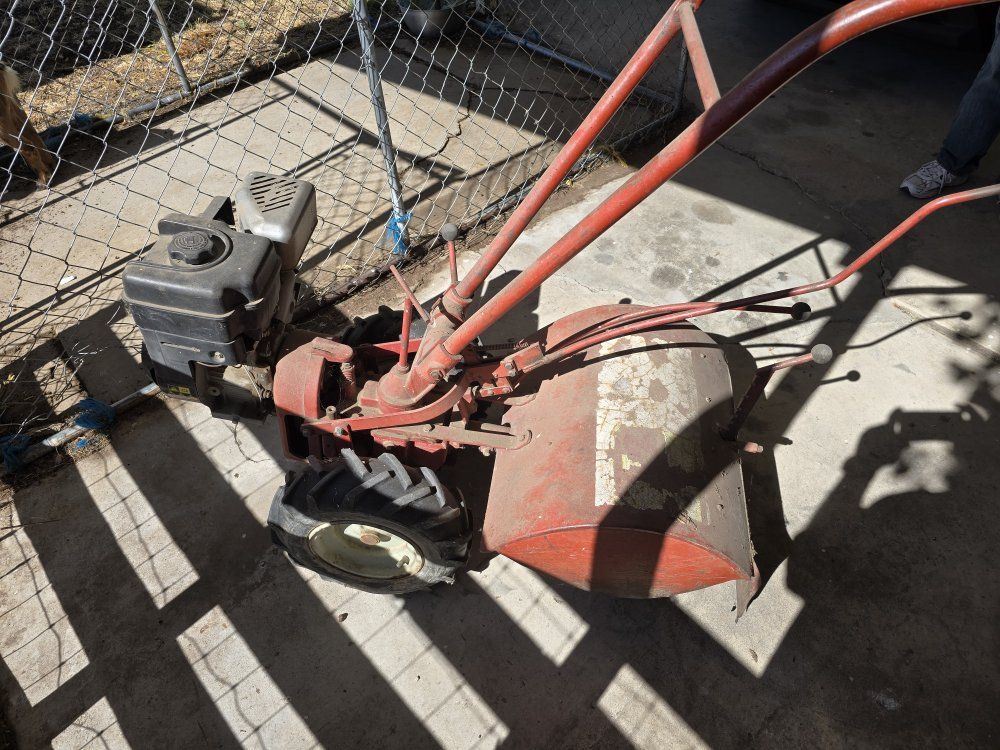 Red Garden Tiller - Used for Cultivating and Aerating Soil