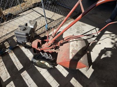 Red Garden Tiller - Used for Cultivating and Aerating Soil