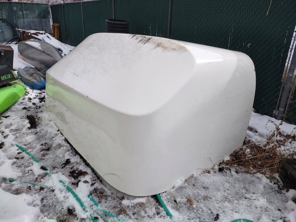 Snowmobile trailer front shield