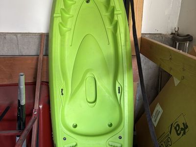 6.5 foot Emotion Kayak and paddle.