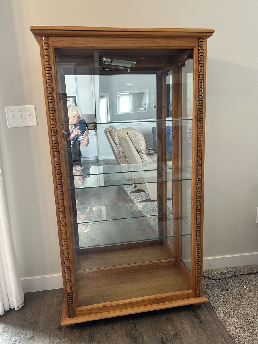 Oak Finish Lighted Curio Cabinet with Mirrored Back and Glass Shelves