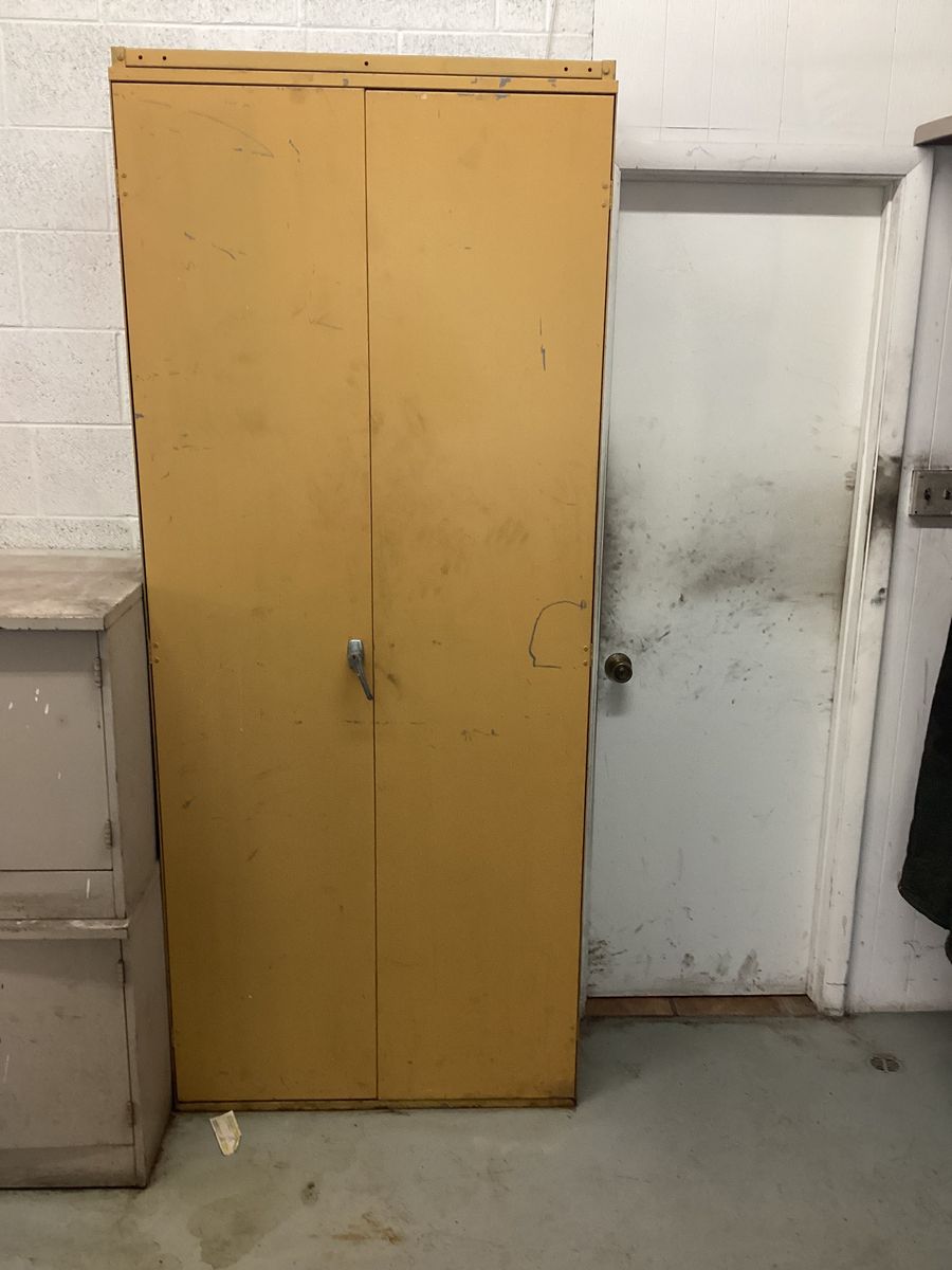 Tall yellow tool cabinet