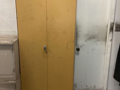 Tall yellow tool cabinet