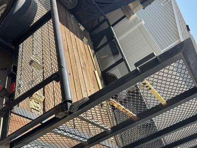 11 foot Single Axle Utility Trailer with Wood Deck and Mesh Ramp Gate.