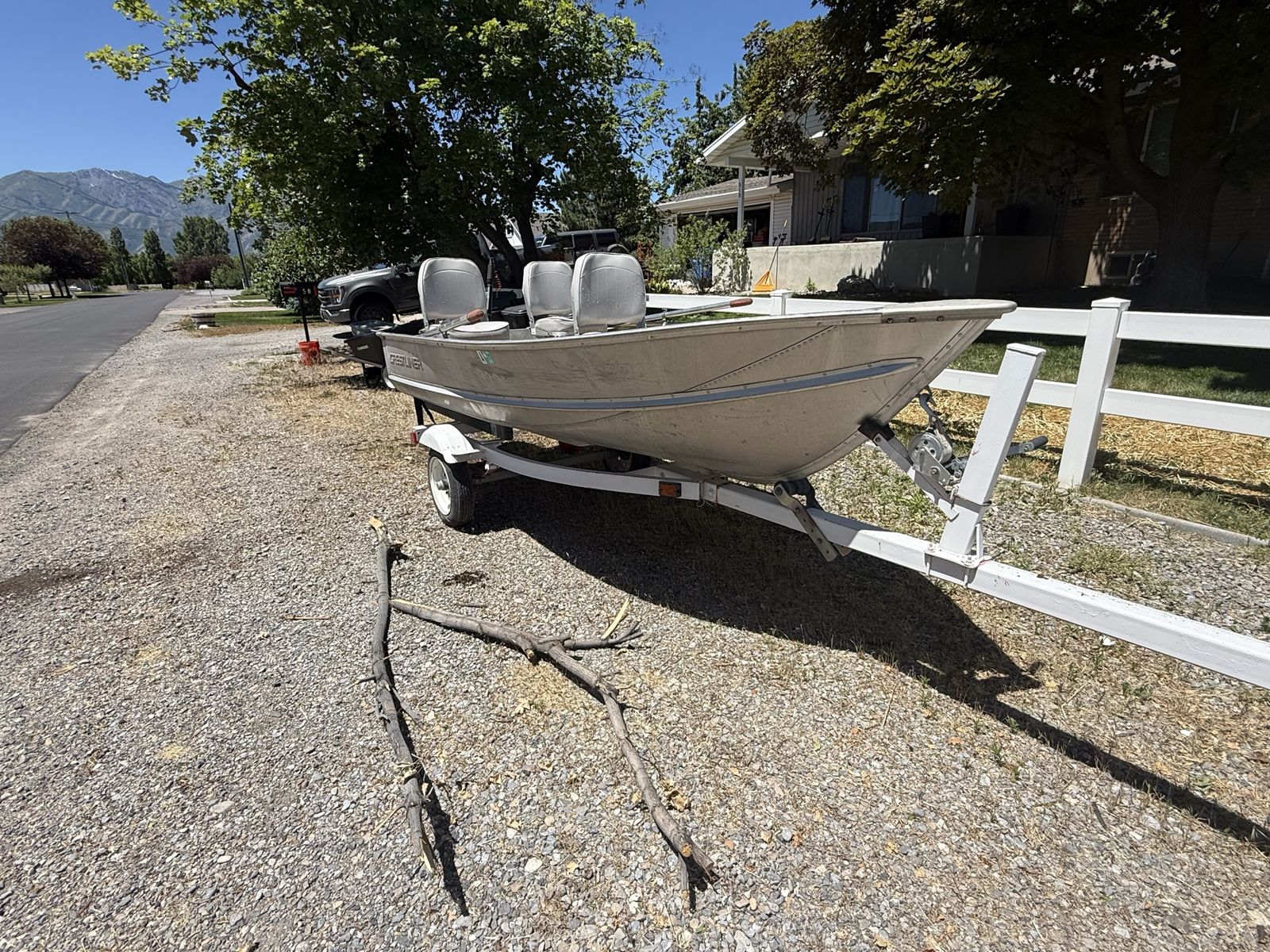 12 ft Crestliner Aluminum Fishing Boat with Evinrude Motor and Trailer